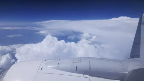 Clouds seen through the window of jet airplane. Airplane flies above the weather Video stock 97051585