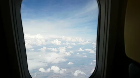Clouds seen from the window of an airplane Video stock 90196806