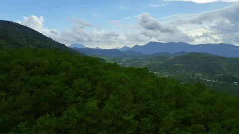 Clouds of Serenity: Aerial Journey to 4K Mountain Peaks in the Jungle Stock Footage 244472063
