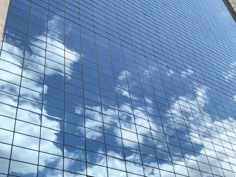 Clouds shadow in glass building Foto stock