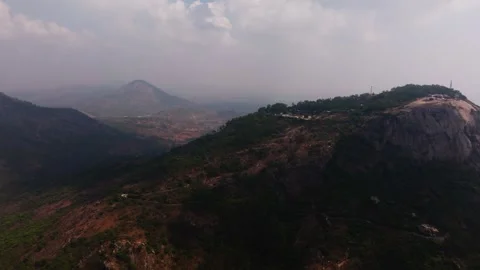 Clouds shadow on top of mountains with nandi hills parking area and misty hills Video stock 340382947