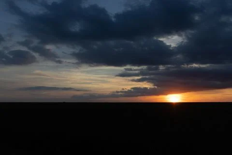 Clouds shadowing the Sun Stock Photos