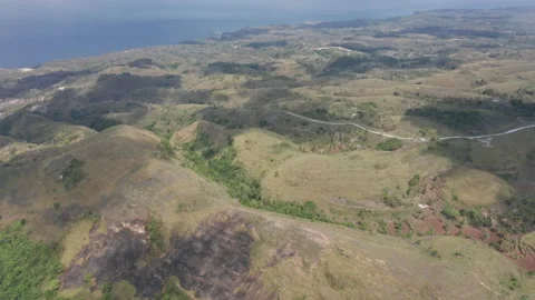 Clouds Shadows Seen on Hills Along Bali, Indonesia Surrounded by Green Fields Stock Footage 133826382