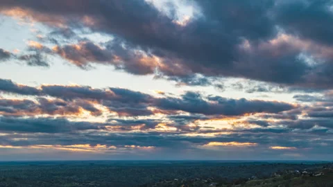 Clouds, Shafts of Sunlight and Mid-Level Clouds Race across the Sky Time Lapse Stock Footage 280927896