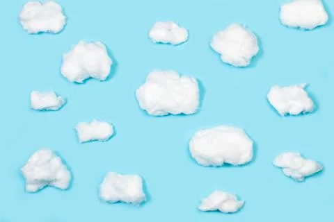 Clouds shaped cotton on a blue background with copy space Stock Photos