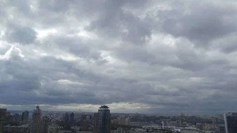 Clouds shed over the city. Time Lapse. Clouds rush over residential buildings Stock Footage 104411987