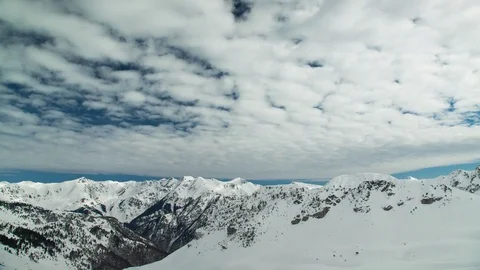 Clouds shifting above snowy mountain Stock Footage 74986766