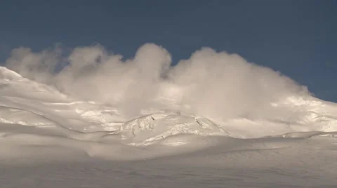 Clouds skimming a tumbling, crevassed glacier Stock Footage 40841752