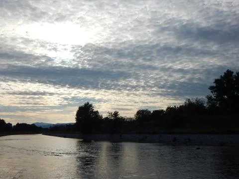 Clouds in the sky above the river  before sunset Stock Photos