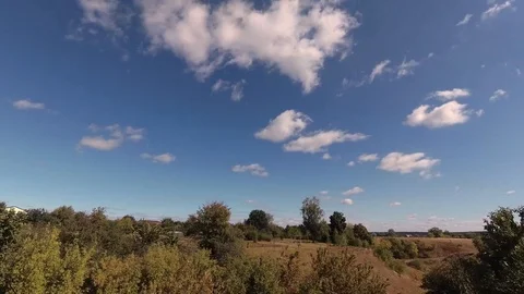 Clouds in the sky against the background of trees timelapse Stock Footage 95281866