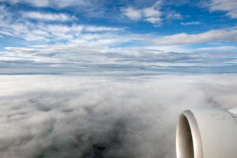 Clouds in the sky from airplane cockpit Stock Photos