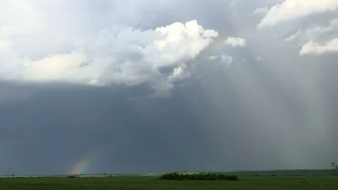 Clouds in the Sky and Rainbow are Moving over the plain TIME LAPSE Stock Footage 108538203
