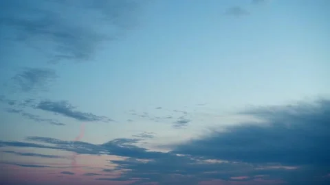 Clouds in the sky are moving at dusk at sunset. Time lapse. Stock Footage 238531072