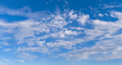 Clouds in sky background blue pattern. Soft white clouds on texture. Bright d Stock Photos