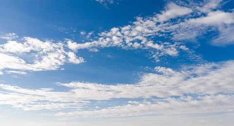 Clouds on sky background blue texture. Bright clouds soft white pattern. Dayt Stockfoto's