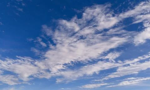 Clouds sky background blue texture. Bright soft clouds white pattern. Dayti.. Stockfoto's