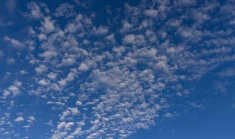 Clouds on sky background blue texture. Bright clouds soft white pattern. Dayt Stockfoto's