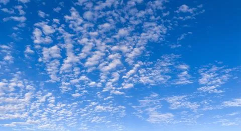 Clouds in sky background texture. Soft white clouds on pattern. Bright dayl.. Stock Photos