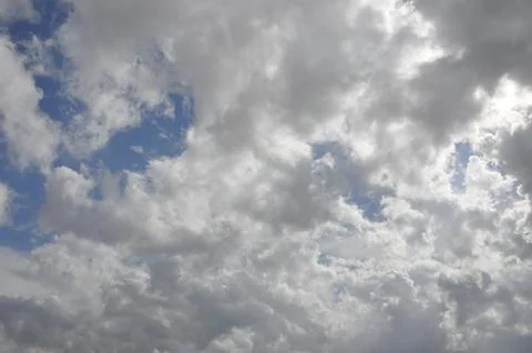 Clouds in the sky with a bit of sky coming through Stock Photos