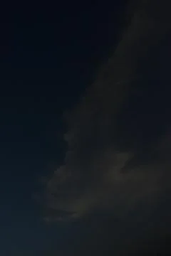 Clouds in the sky drifting away in a light breeze Stock Photos
