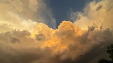 Clouds in the sky during sunset showing bright colors with dark tones visib.. Stock Photos