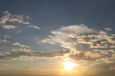 Clouds in the sky in the evening while the sun is setting Stock Photos