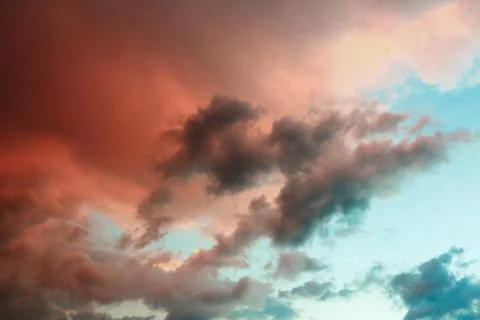 Clouds in the sky illuminated by the setting sun. 스톡 사진
