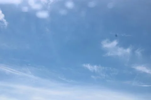 Clouds in the sky with lens flare. Stock Photos