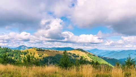 Clouds sky motion fast over summer alpine mountains nature Time lapse Stock Footage 153848873