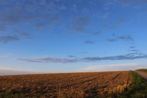 Clouds in the sky over a field Stock Photos