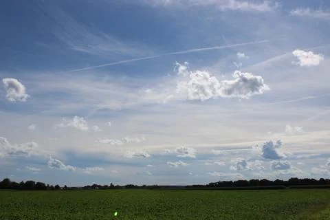 Clouds in the sky over fields Stock Photos