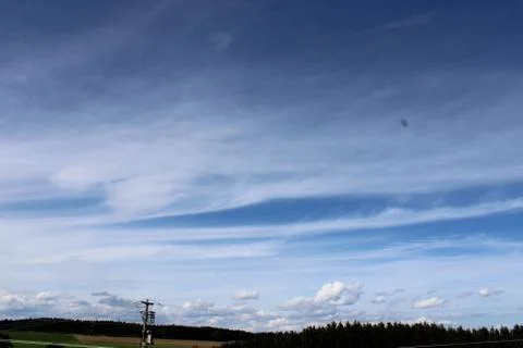 Clouds in the sky over forest Stock Photos