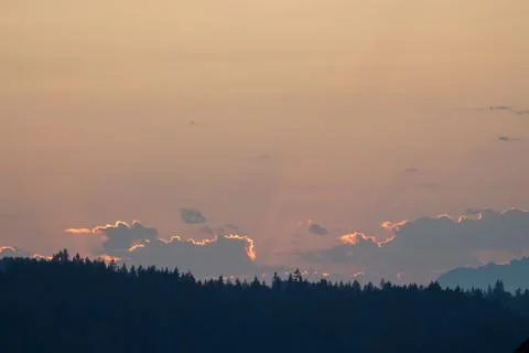 Clouds in the sky over the mountain at sunset Stock Photos