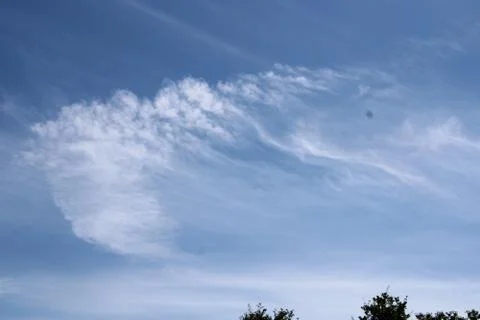 Clouds in the sky over trees Stock Photos