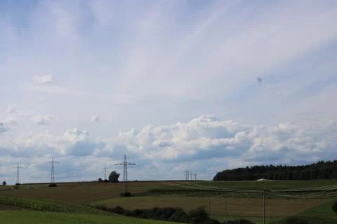 Clouds in the sky with powelines Stock Photos