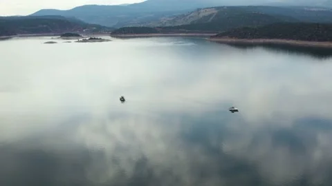 Clouds Sky Reflection on Lake Water Surface with Boats at Flaming Gorge Stock Footage 205187278