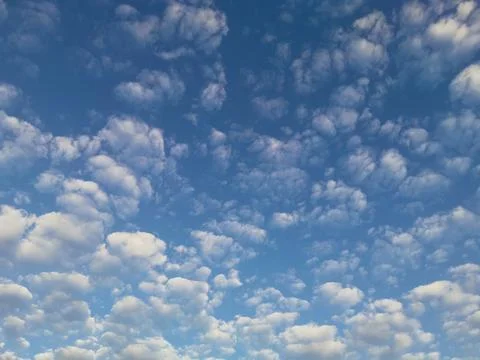 Clouds in the Sky Scattered in a Perfect Pattern Stock Photos