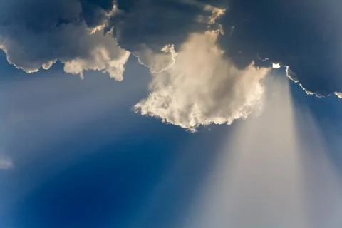 Clouds in sky with sunrays on sunrise Stock Photos