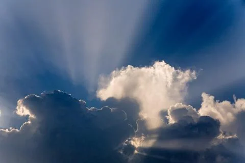 Clouds in sky with sunrays on sunrise Stock Photos