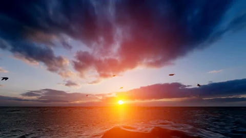 Clouds on the sky at sunset, panning shot over ocean Stock Footage 169514739