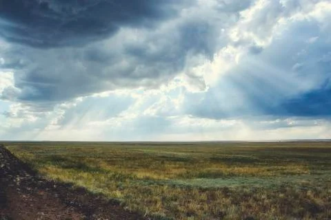 Clouds in the sky before a thunderstorm with sunbeams Stock Photos