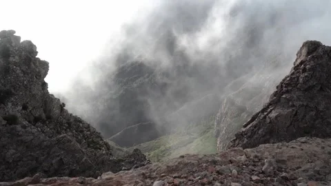 Clouds slide down the hillside in La Gomera Stock Footage 320764558