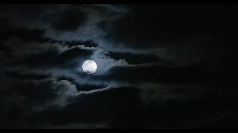 Clouds Sliding Over the Moon Stock Footage 202088459