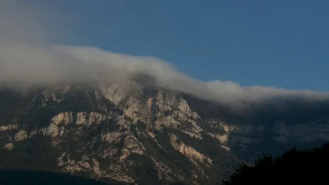 Clouds slipping over the mountain Timelapse Stock Footage 69874319