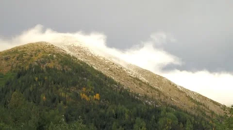 Clouds Slowly climbing mountain in the fall. Stock Footage 10748792