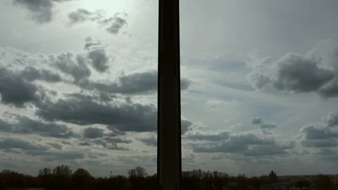 Clouds slowly float across the sky, rays of the sun, view from the window Stock Footage 155939634