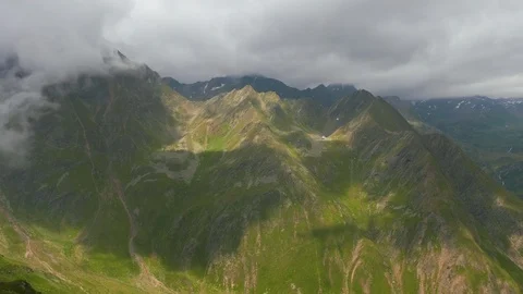 Clouds slowly move over Swiss Italian alps at Timmelsjoch pass Stock Footage 96771448