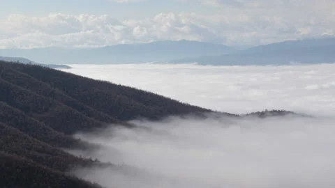 Clouds slowly moving on the side of the mountain, Full HD 1080 Cinematic Video stock 146914996