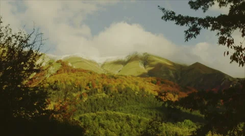 The clouds slowly touching and mountains gently. Tuscany, Italy. Stock Footage 64738503