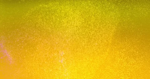 Clouds of small gas bubbles slowly move through the colored liquid. Stock Footage 144985846